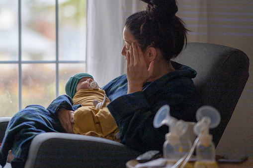 mom holding baby
