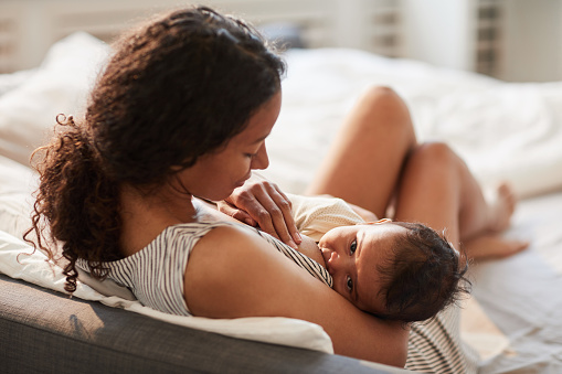 mom breast feeding baby