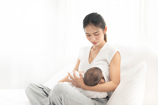 mom breast feeding baby