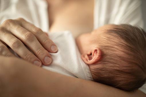 mom breast feeding baby