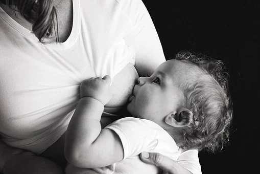 mom breast feeding baby